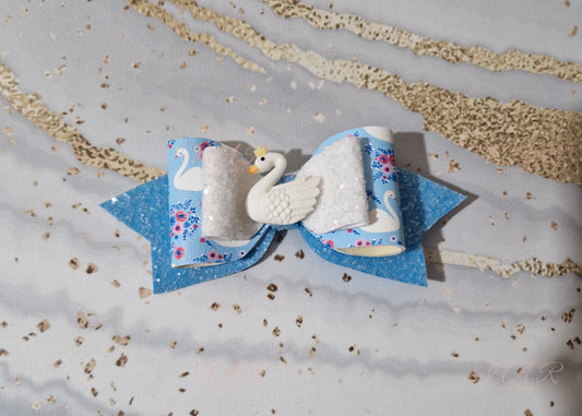 Large Swan bow with matching blue and white glitter fabric and finished with a beautiful Swan embellishent.